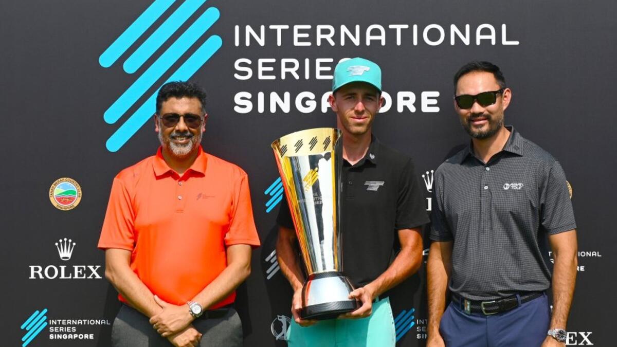 International Series Singapore winner David Puig (centre) with Rahul Singh (left) and Cho Min Thant (right) from the Asian Tour at Tanah Merah Country Club (Tampines Course) on the Asian Tour. - Supplied photo