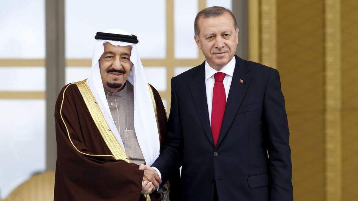 Turkey's President Tayyip Erdogan (R) and Saudi King Salman shake hands during a welcoming ceremony in Ankara, Turkey April 12, 2016.