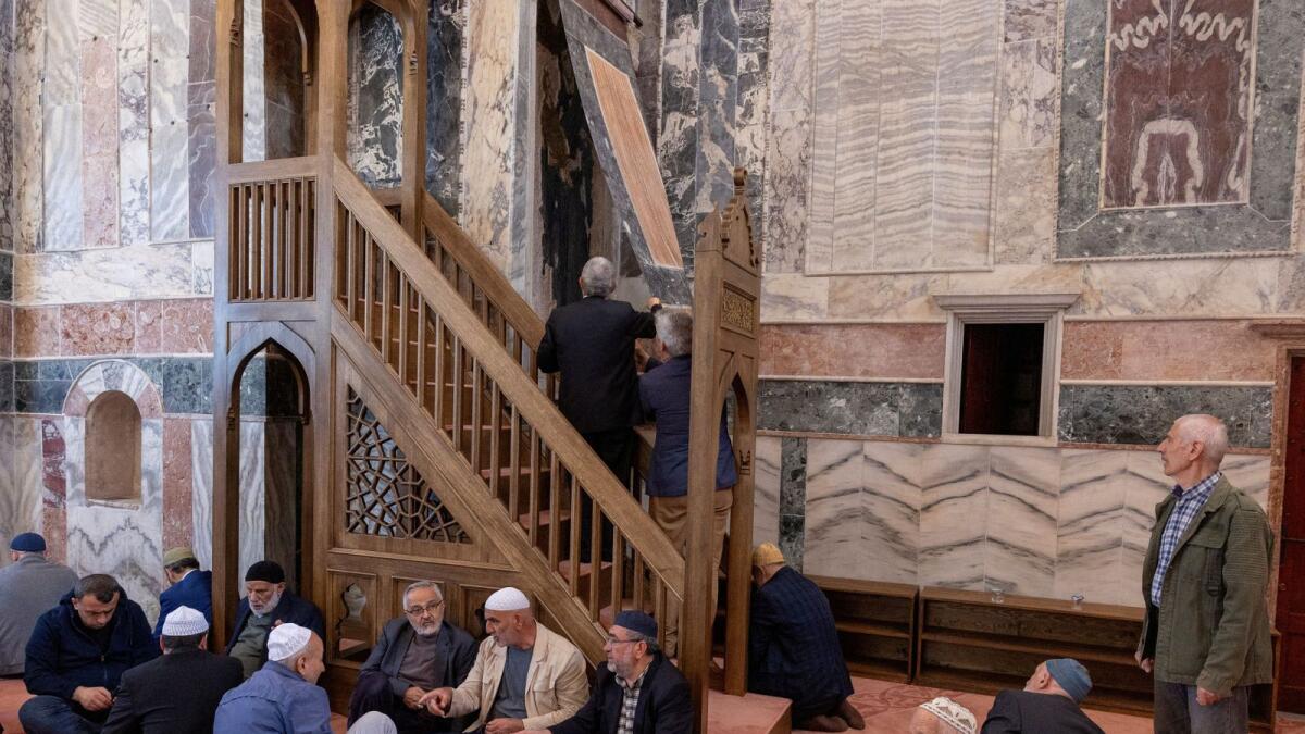 Worshippers look at the covered frescoes before they attend an afternoon prayer at Chora Museum or Kariye Mosque. — Photo: Reuters