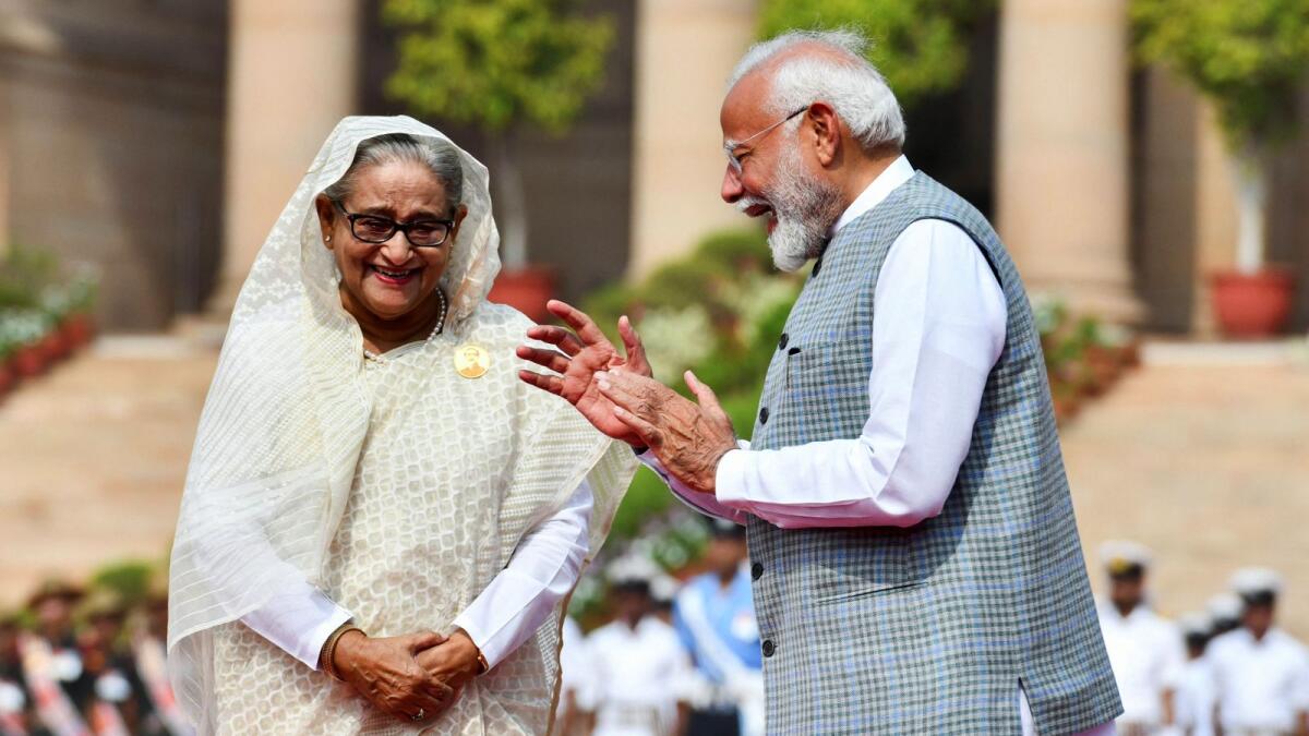 India's Prime Minister Narendra Modi speaks with Bangladesh's Prime Minister Sheikh Hasina during her ceremonial reception at the Forecourt of India's Rashtrapati Bhavan Presidential Palace in New Delhi on Saturday. Photo: Reuters
