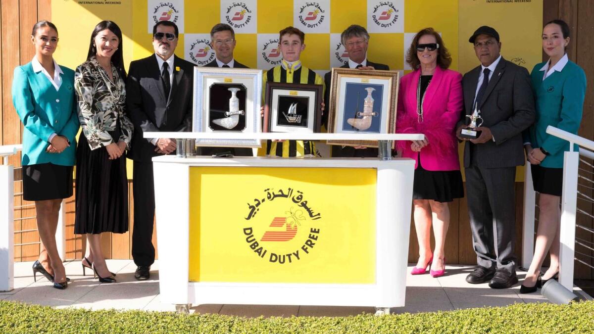 Dubai Duty Free officials and winning connections at last season's Dubai Duty Free International Weekend at Newbury Racecourse in England. - Supplied photo