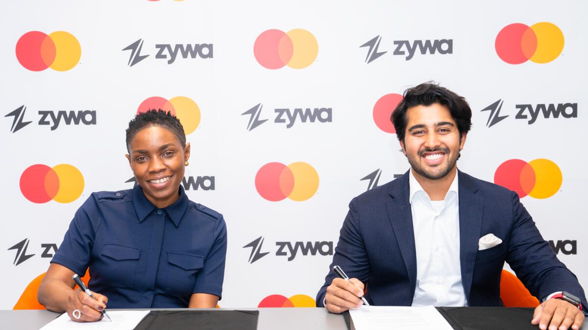 Ngozi Megwa, Senior Vice President, Digital Partners and Enablers, EEMEA, Mastercard, (left) and Alok Kumar, Zywa’s Co-founder and CEO, sign the agreement. - Supplied photo