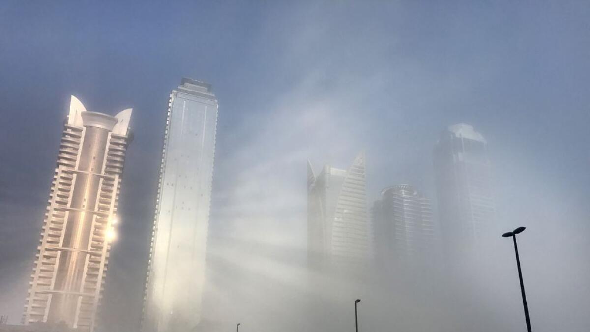 Fog envelopes the buildings in Dubai 