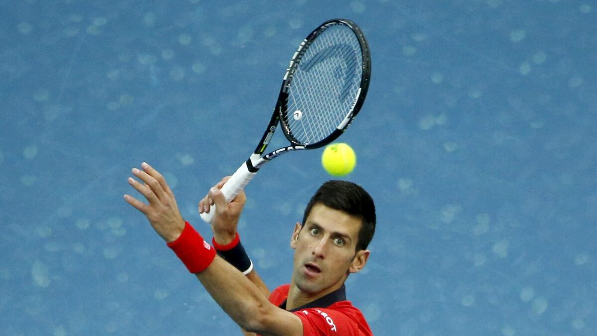 Novak Djokovic of Serbia hits a return against Zhang Ze of China during their men's singles match at the China Open tennis tournament in Beijing, China, October 8, 2015.    REUTERS/Kim Kyung-Hoon