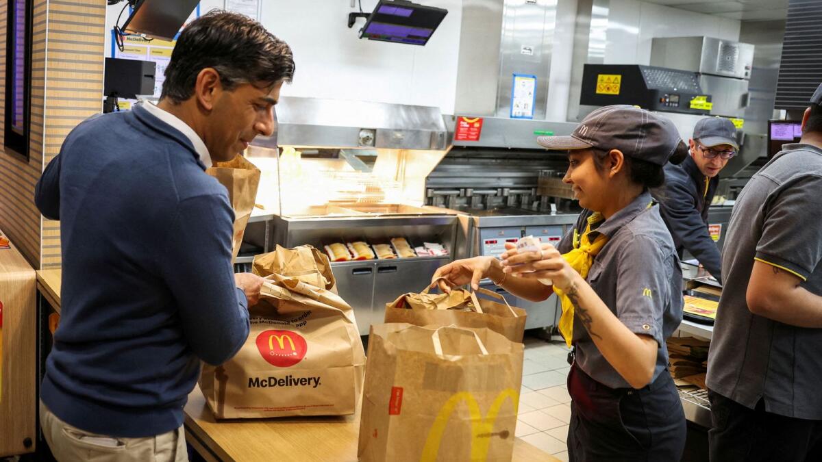 British Prime Minister Rishi Sunak collects McDonald's on the day of a Conservative general election campaign event Beaconsfield service station in Buckinghamshire on July 2, 2024. — Reuters