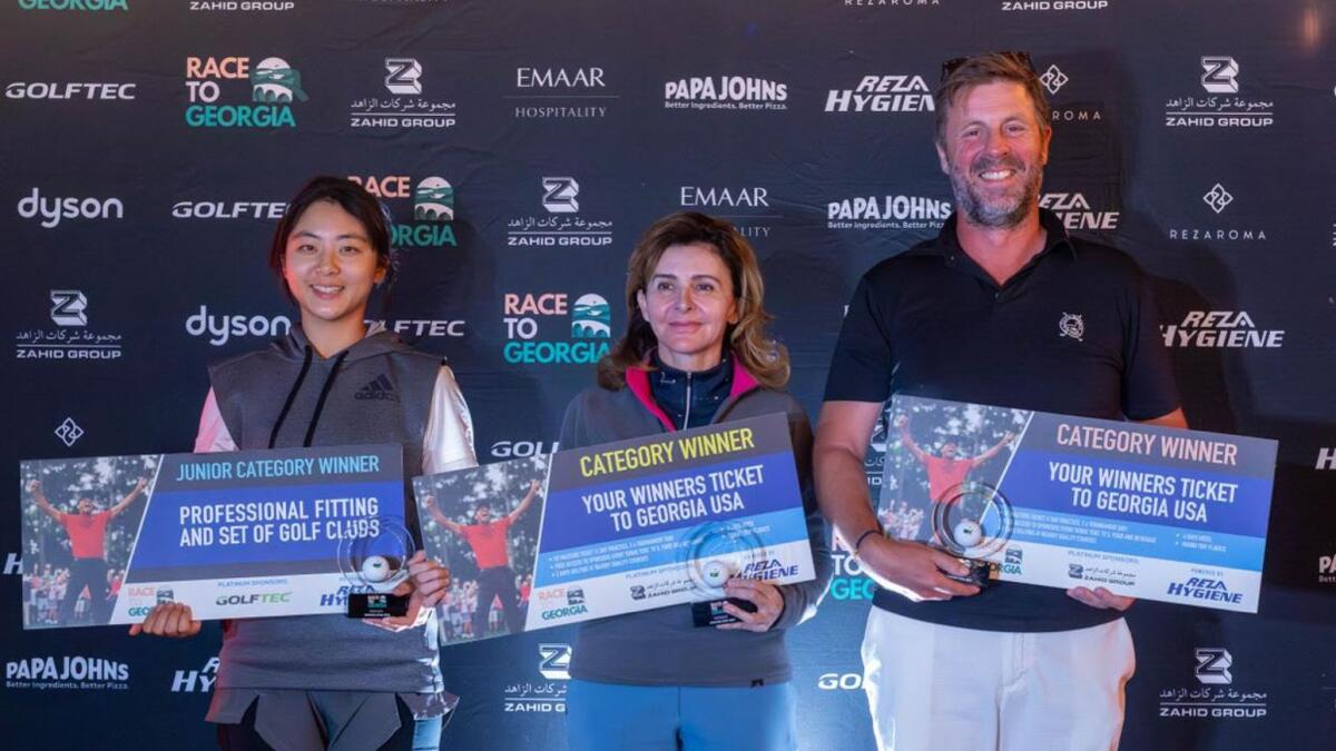 Winners of the UAE Final of the Race to Georgia, left to right: Daul Kim, Dania Mchaourab and Quinten Morel, at the prize giving at Montgomerie Golf Club. - Supplied photo