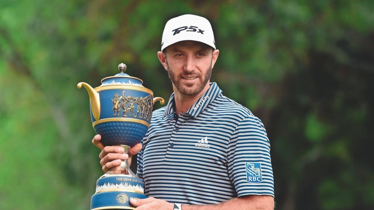 Johnson holds off McIlroy for title