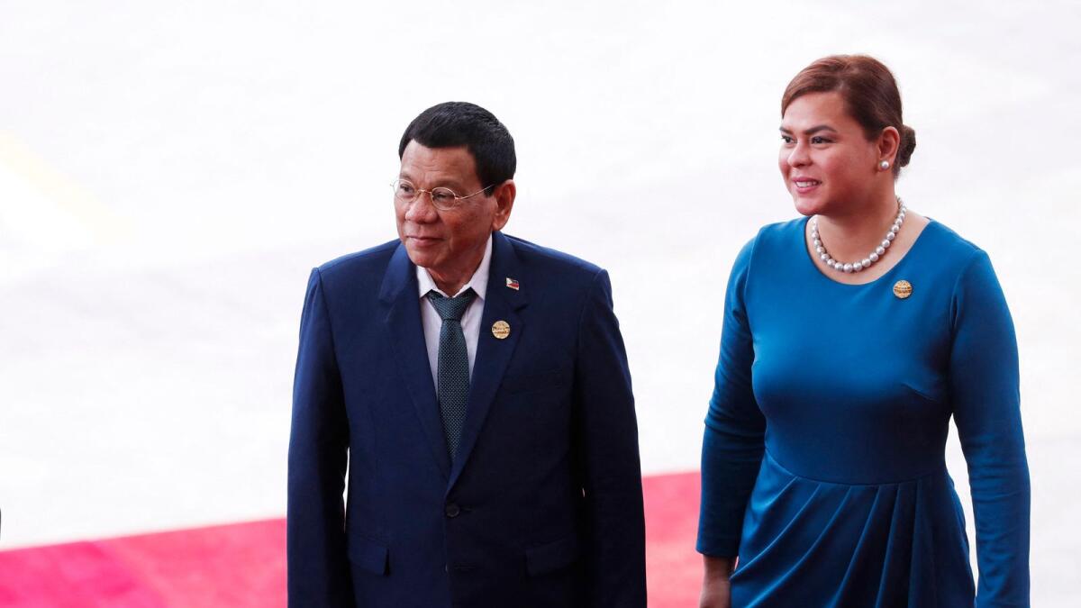 Rodrigo Duterte with his daughter Sara Duterte.  AFP file photo
