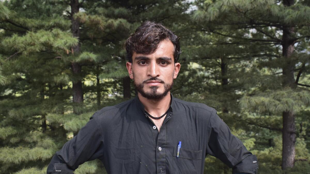 Gul Faraz (centre), a survivor of the cable car incident. — AP