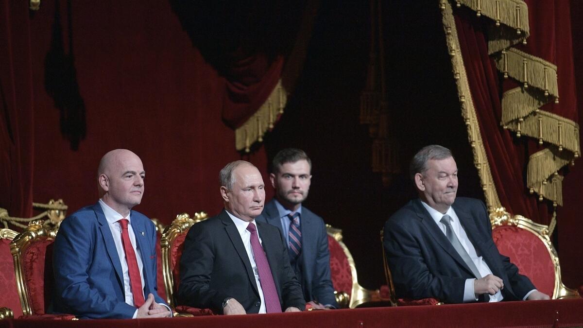Russian President Vladimir Putin, center, FIFA President Gianni Infantino, left, and Director of the Bolshoi Theater Vladimir Urin, right.-AP
