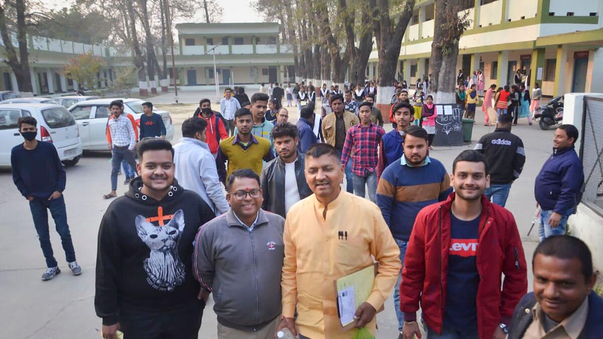 Age no bar: Former BJP MLA Rajesh Mishra (centre) leaves examination centre after appearing in Class 12 UP Board exam in Bareilly. — PTI file