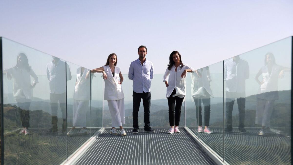 Architects Cassandra, Elena and Nicodemos Tsolakis pose for a picture at Troodos astronomical observatory in Agridia village, Cyprus, on June 13, 2024. — Reuters