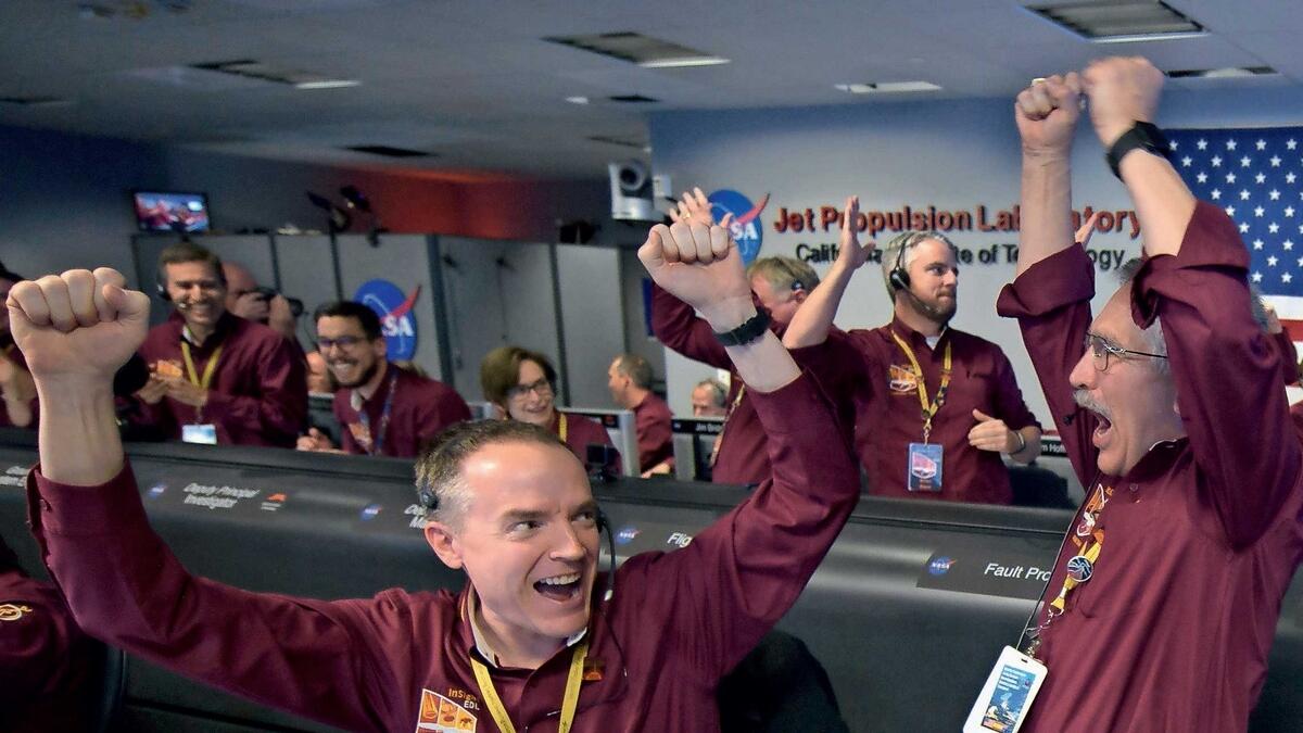 Mars InSight team members Kris Bruvold and Sandy Krasner rejoice after receiving confirmation that the Mars InSight lander successfully touched down on the surface of Mars.- Agencies