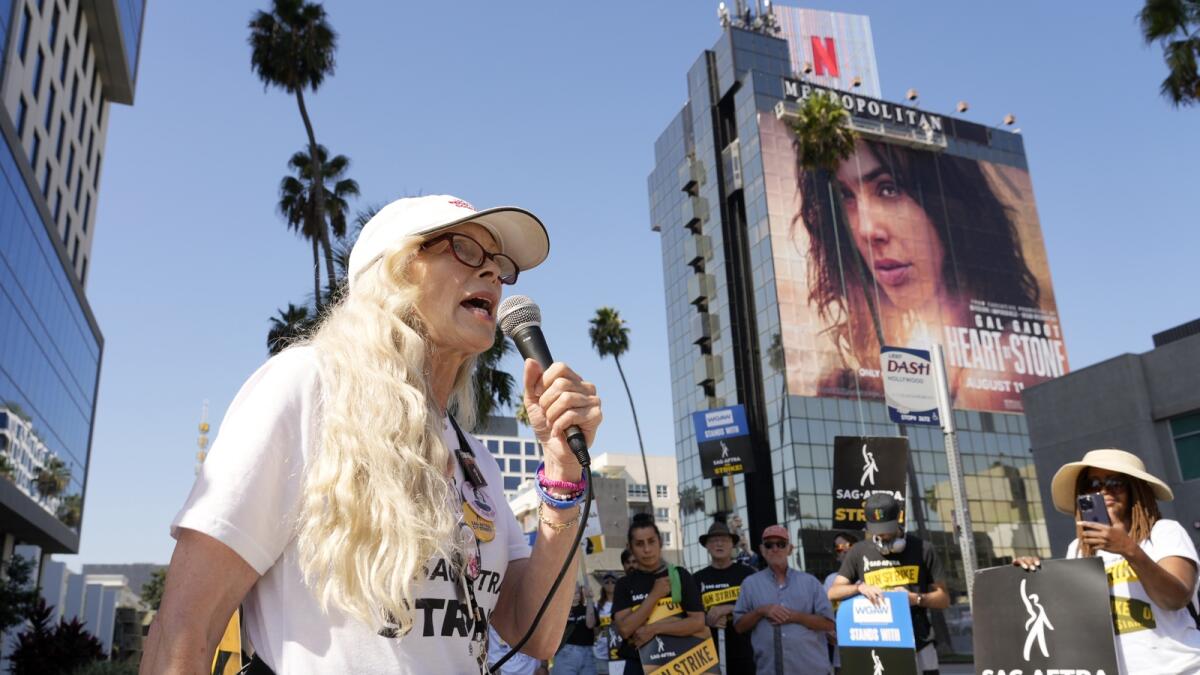 Actor Frances Fisher addresses picketers outside Netflix studios. — AP