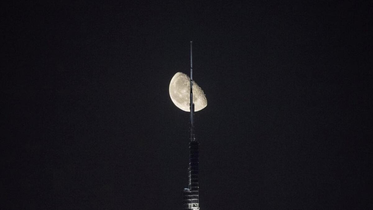 Video: Moon passes by Dubais Burj Khalifa during Ramadan