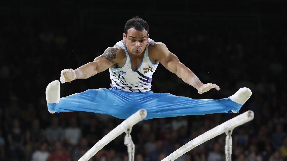 Rakesh Patra of India on the parallel bars.