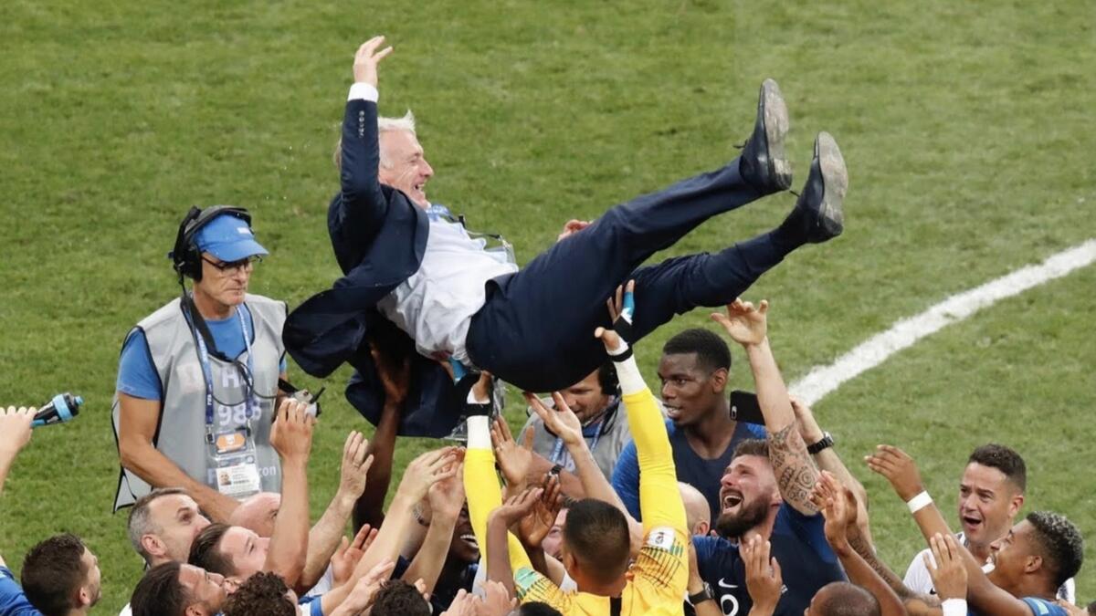 France coach Didier Deschamps is held up by players to celebrate winning the World Cup. Reuters