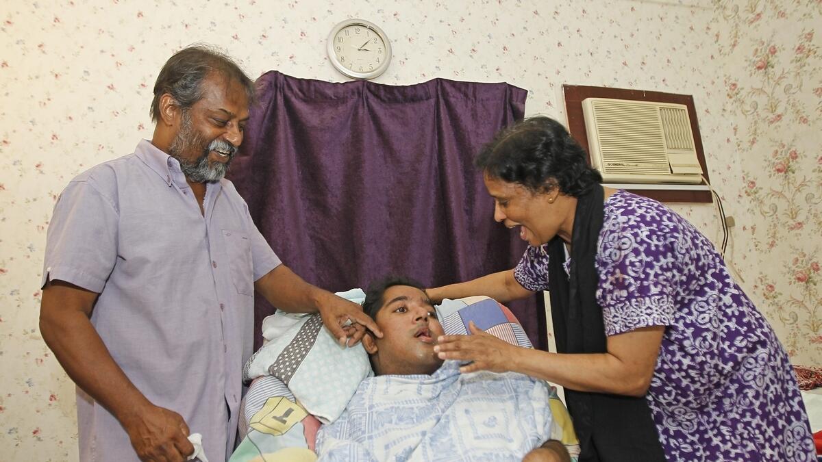 Elsy Joseph and Diago Dsouza with their 26-year-old son Savio Marcus Dsouza at their home in Sharjah – Photo by M. Sajjad