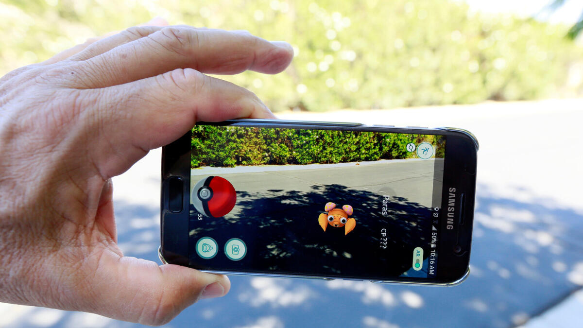 The augmented reality mobile game Pokemon Go by Nintendo is shown on a smartphone screen. — Reuters