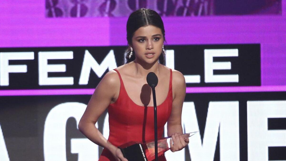 Selena Gomez accepts the favorite female artist pop/rock award.- AP