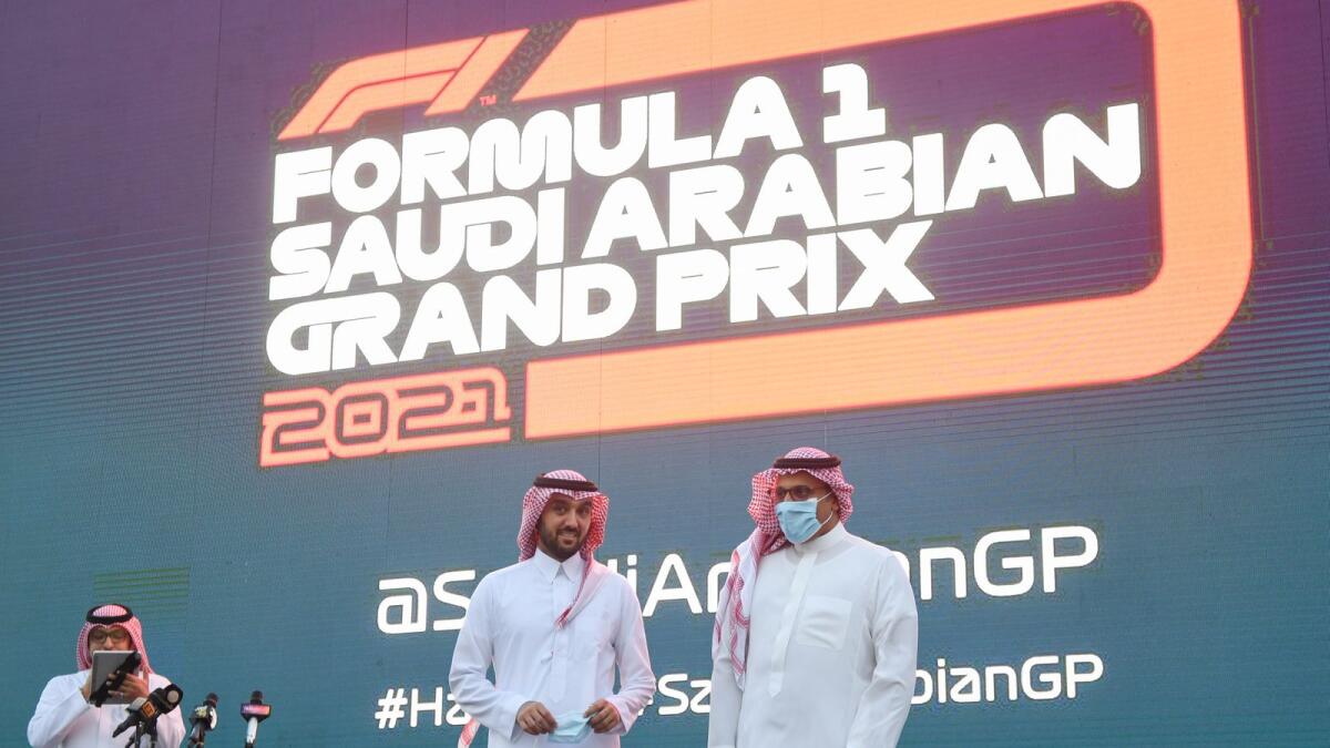 Saudi Sports Minister Prince Abdulaziz bin Turki (C) and Khalid bin Sultan Al Faisal, Chairman of the Saudi Automobile and Motorcycle Federation, a nnounce the Saudi Arabian Grand Prix in Jeddah on November 5, 2020.