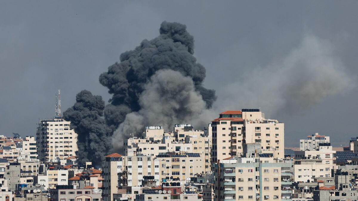 Smoke rises following Israeli strikes in Gaza, October 7, 2023. Reuters