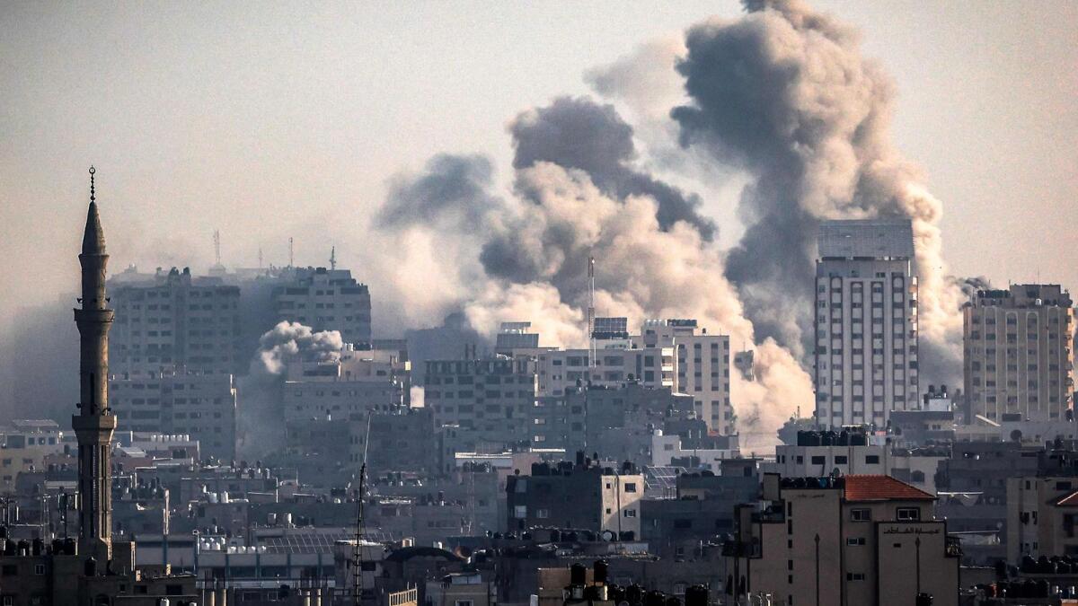 Smoke plumes billow during Israeli air strikes in Gaza City on October 12 as raging battles between Israel and the Hamas movement continue for the sixth consecutive day. — AFP