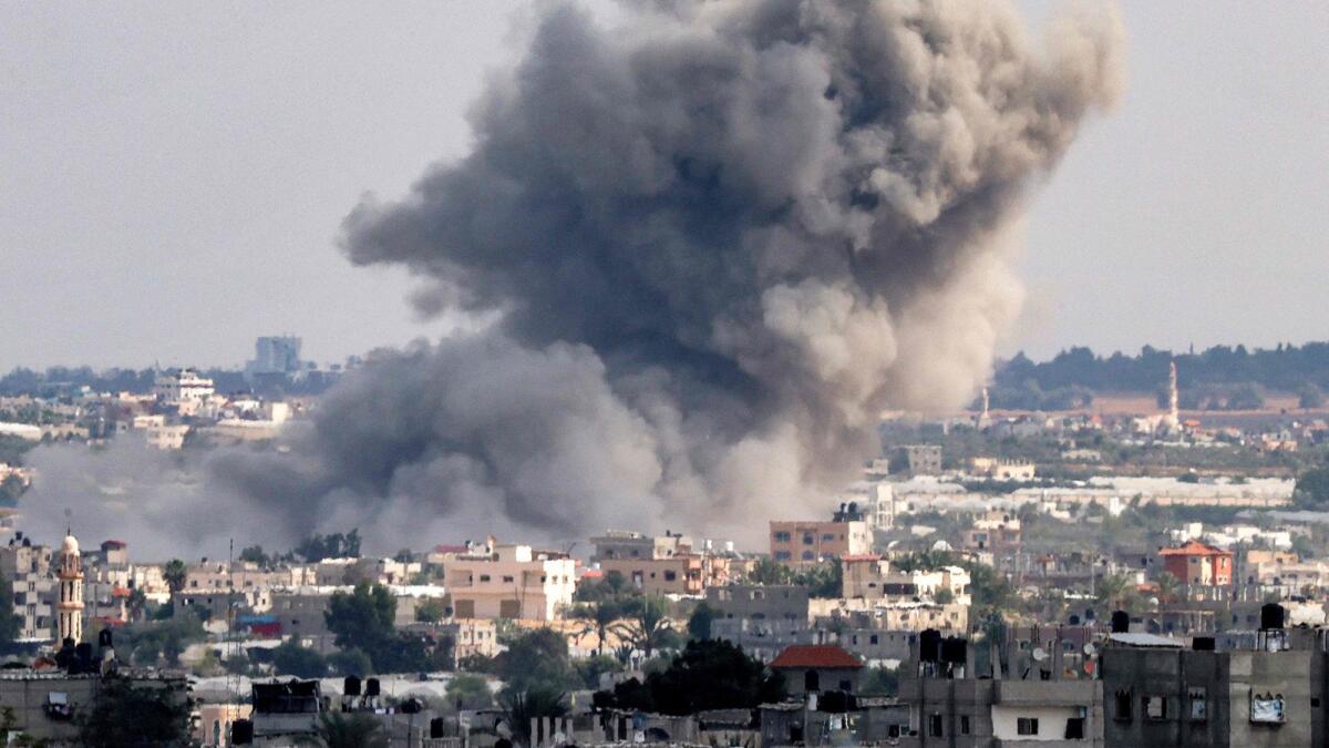 Smoke plumes billow after an explosion during Israeli bombardment in Rafah in the southern Gaza Strip on October 18.— AFP