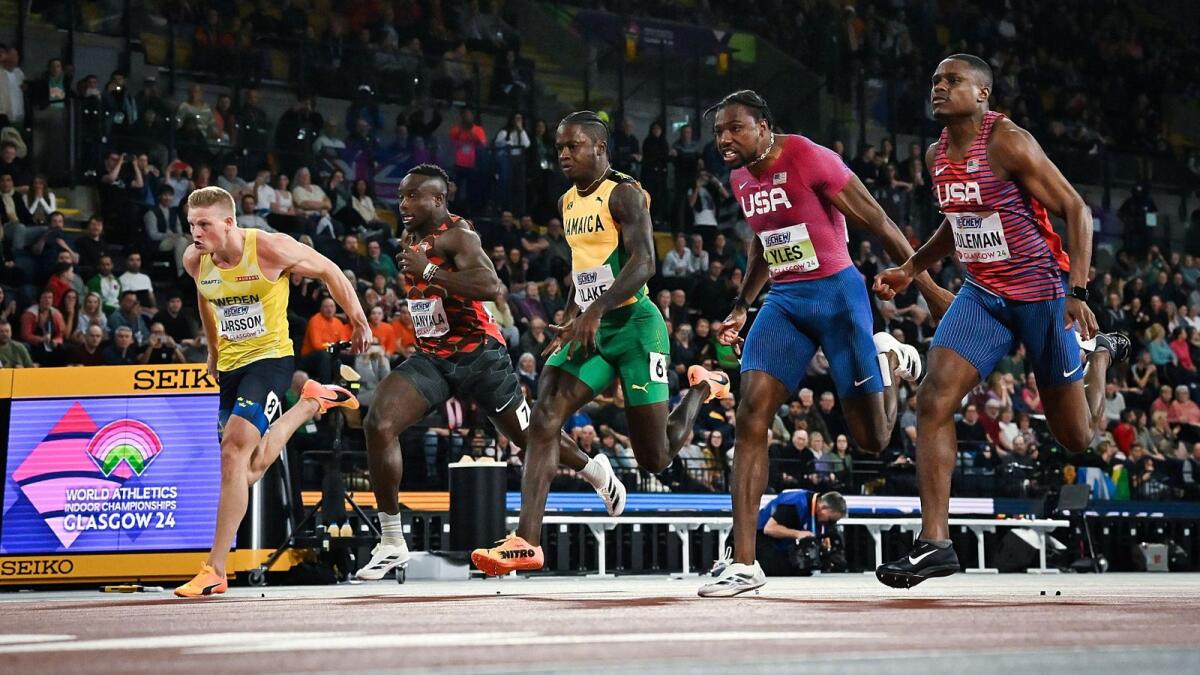 Christian Coleman (R) competes with (From L) Sweden's Henrik Larsson, Kenya's Ferdinand Omanyala, Jamaica's Ackeem Blake and Noah Lyles in the Men's 60m final during the Indoor World Athletics Championships in Glasgow, Scotland. - AFP