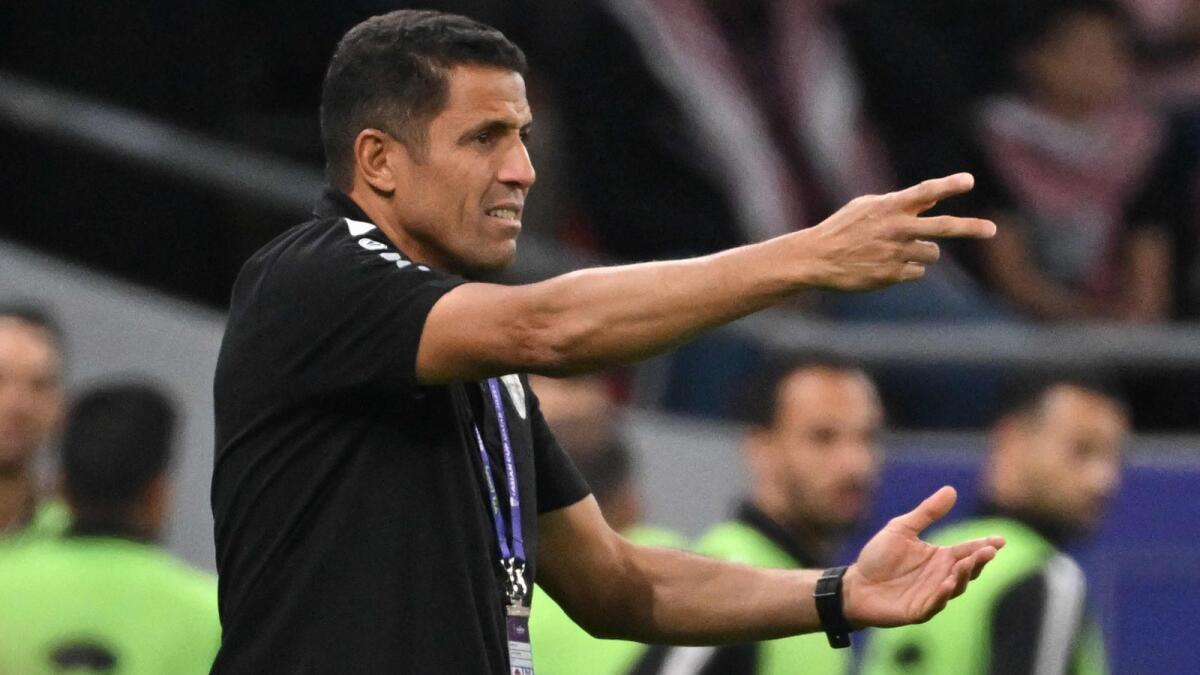 Jordan's Moroccan coach Hussein Ammouta gives instructions during the Qatar 2023 AFC Asian Cup semifinal against South Korea.  - AFP