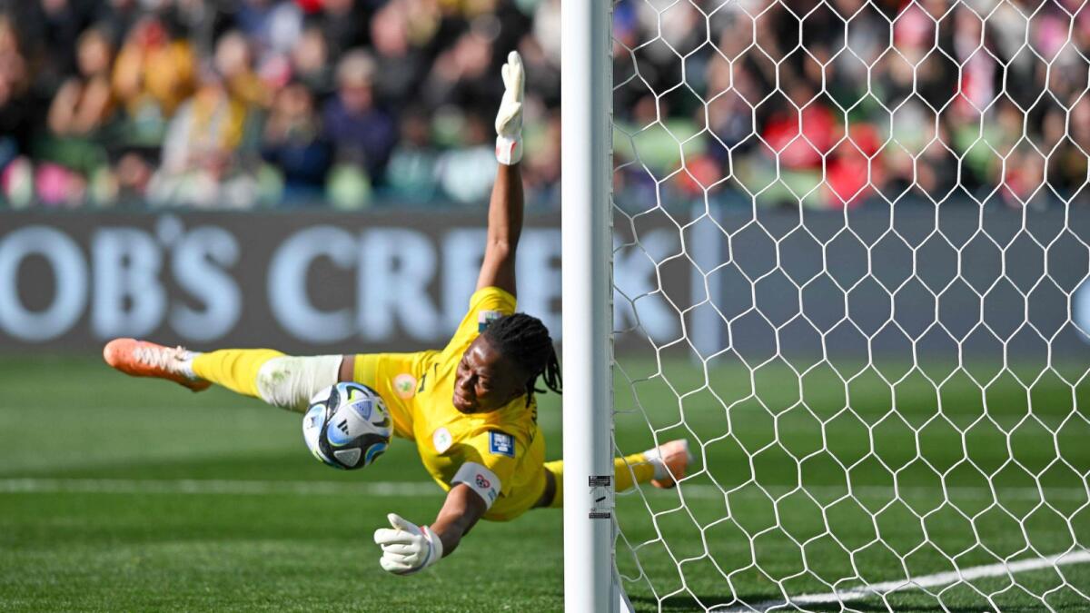 Nigeria's goalkeeper Chiamaka Nnadozie saves a penalty kick by Canada's forward Christine Sinclair during the Australia and New Zealand 2023 Women's World Cup Group B match. - AFP