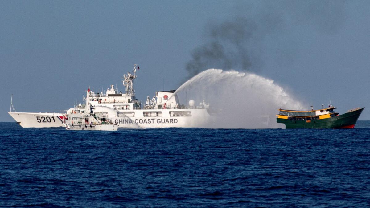 Chinese Coast Guard vessels were seen firing water cannons towards a Philippine resupply vessel Unaizah on May 4. — File photo: Reuters