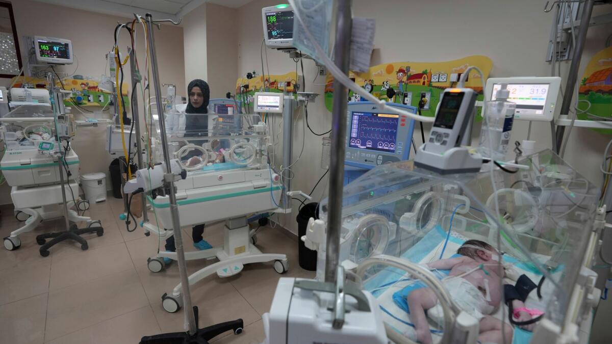 Palestinian doctors treat a prematurely born baby at Al Aqsa Hospital in Deir El Balah, Gaza Strip, on Sunday. — AP