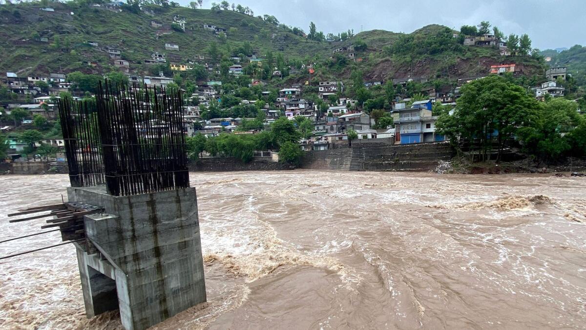 A general view of an overflowing Jhelum River after heavy rainfall in Muzaffarabad on April 29, 2024. Photo: AFP file