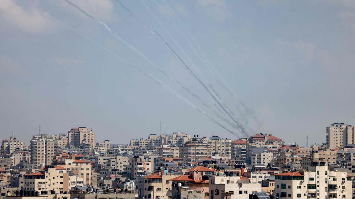 A salvo of rockets is fired by Hamas militants towards Israel in Gaza City on October 13 — AFP