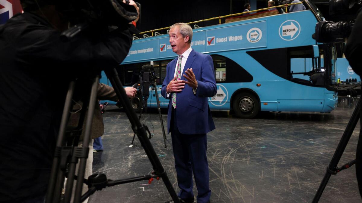 Britain's Reform UK party leader Nigel Farage speaks during an interview after a rally at the NEC in Birmingham on June 30, 2024. — Reuters