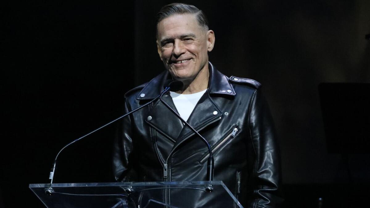 TORONTO, ONTARIO - SEPTEMBER 24: Bryan Adams speaks onstage during the 2022 Canadian Songwriters Hall Of Fame Gala at Massey Hall on September 24, 2022 in Toronto, Ontario.   Jeremy Chan/Getty Images/AFP