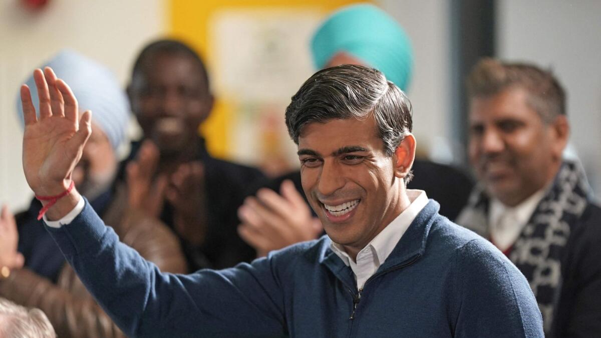 Britain's Prime Minister Rishi Sunak waves during a visit to the MyPlace Youth Centre, in Mansfield. — AFP