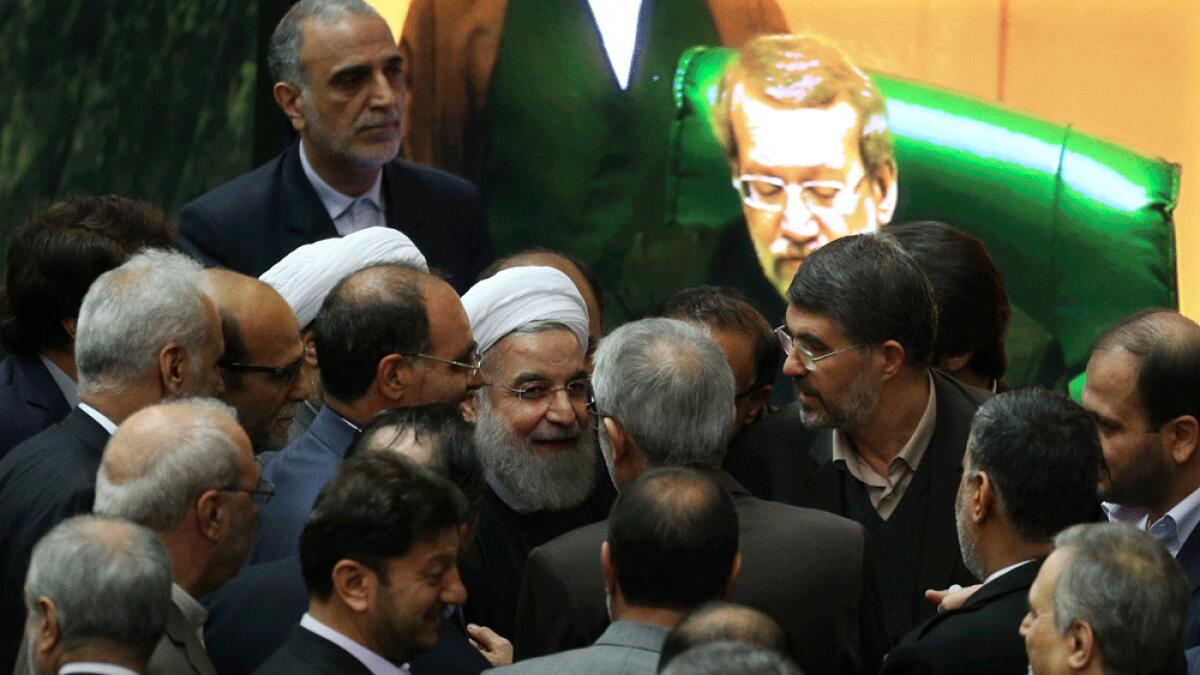 Iran welcomes sanctions end, but tough thaw ahead 