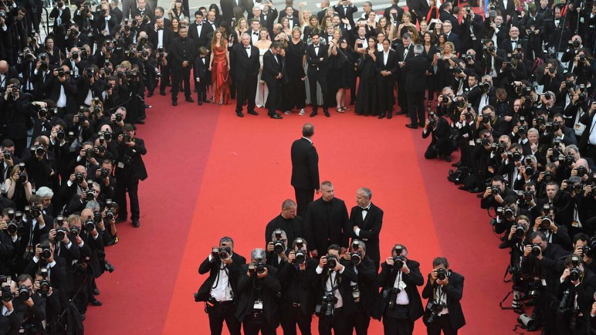 Photographers take photos of guests arriving for the screening of the film 'The BFG' at the 69th Cannes Film Festival in Cannes, southern France. 