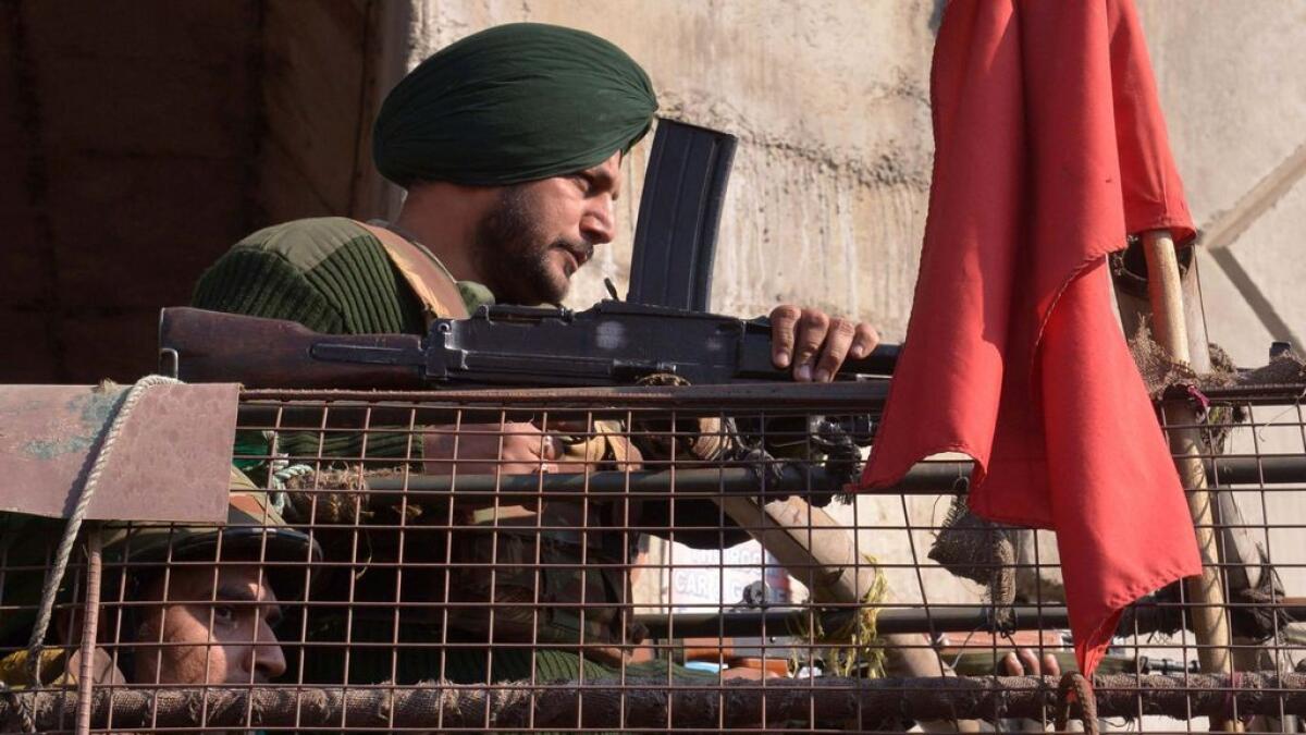 Indian security personnel stand alert near the airforce base in Pathankot on Tuesday.