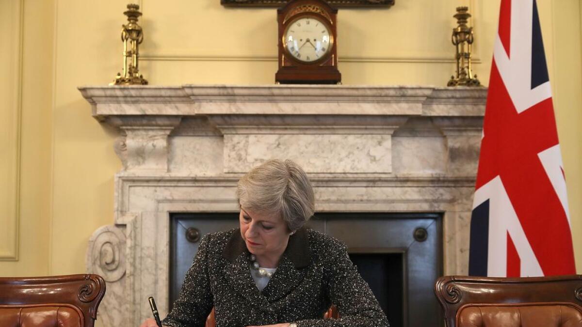 May signs Article 50 notification letter to EU leader  