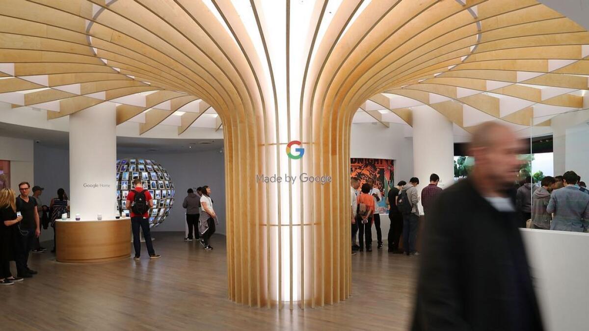 People visit the new Google pop-up shop in the SoHo neighborhood on October 20, 2016 in New York City. The shop lets people try out new Google products such as the Pixel phone, Google Home, and Daydream VR. - AFP file photo