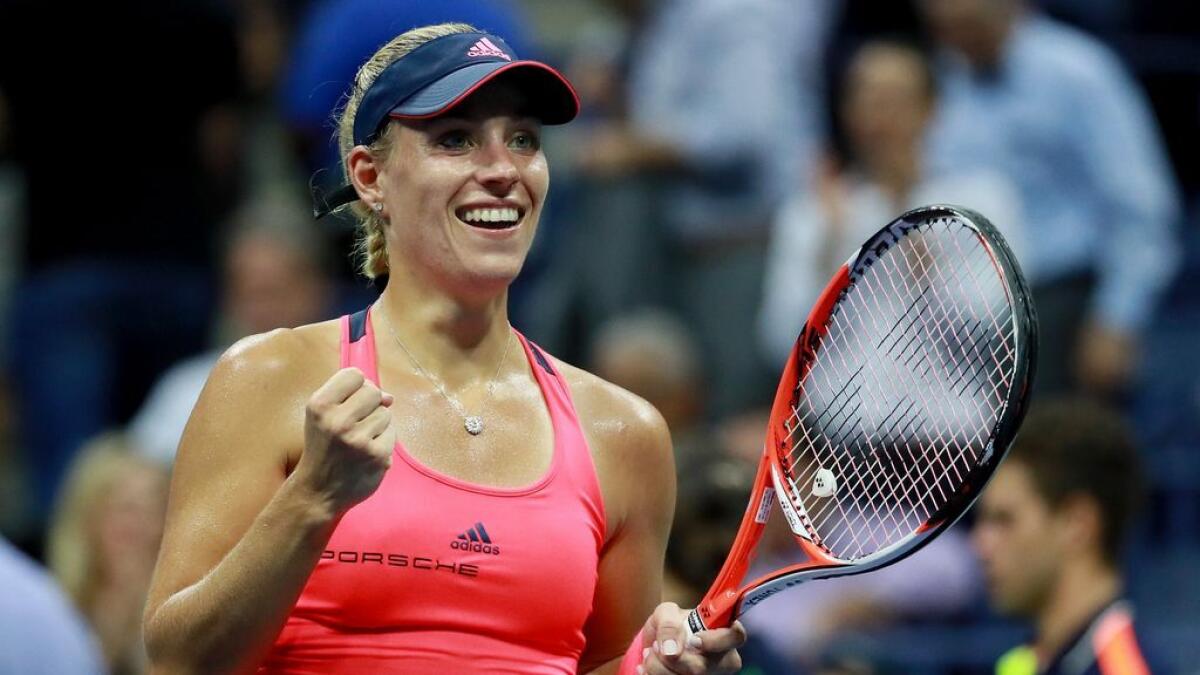 Angelique Kerber of Germany reacts after beating Caroline Wozniacki of Denmark