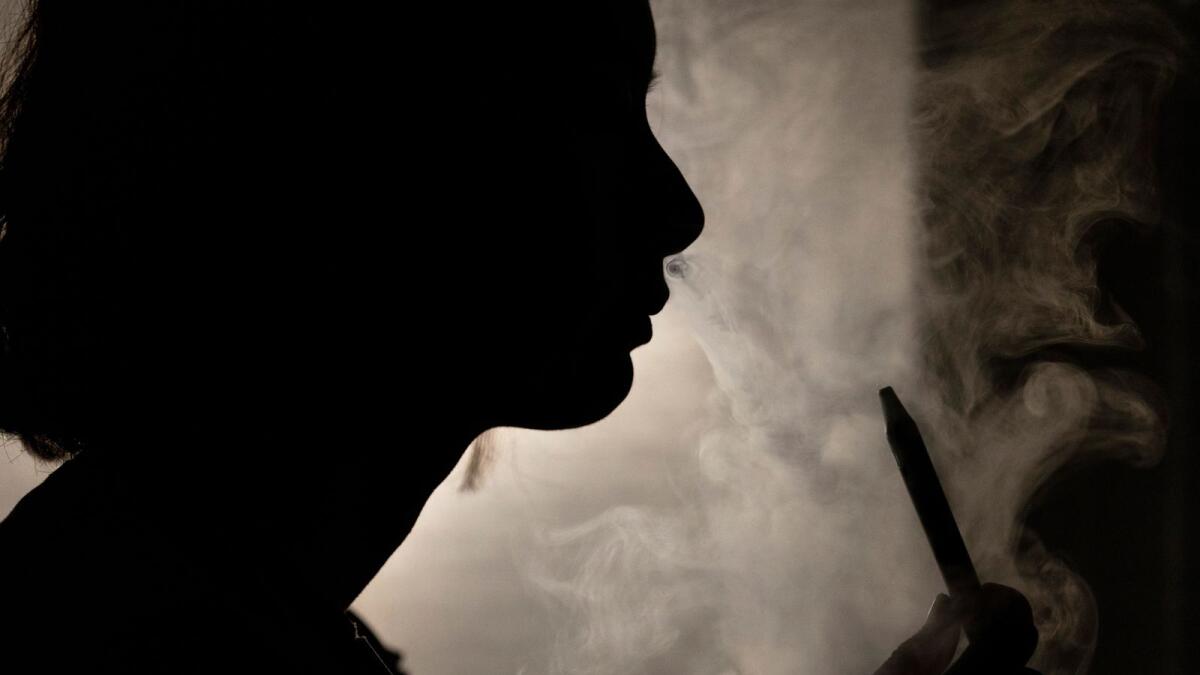 A person seen vaping in a photograph. — Photo: AP file