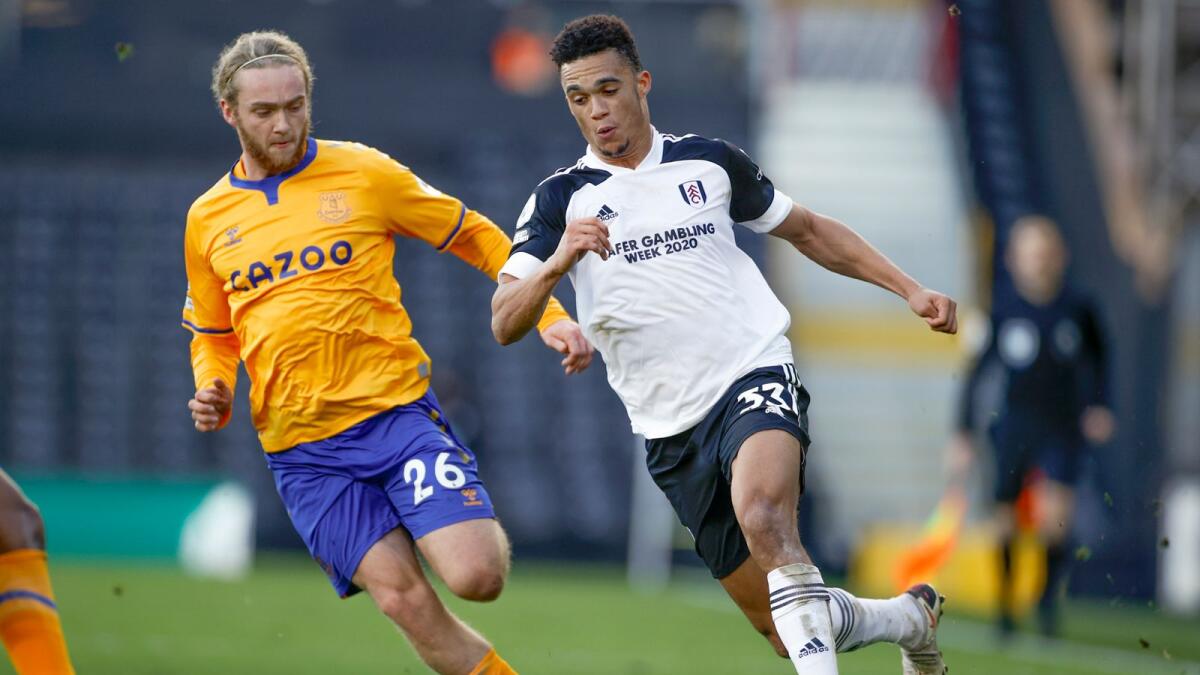 Everton's Tom Davies and Fulham's Antonee Robinson go for the ball.— AP