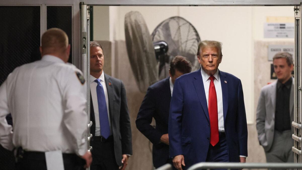 Republican presidential candidate Donald Trump walks with his attorney Todd Blanche, as his criminal trial over charges that he falsified business records to conceal money paid to silence porn star Stormy Daniels in 2016 continues, at Manhattan state court in New York City. — Photo: Reuters