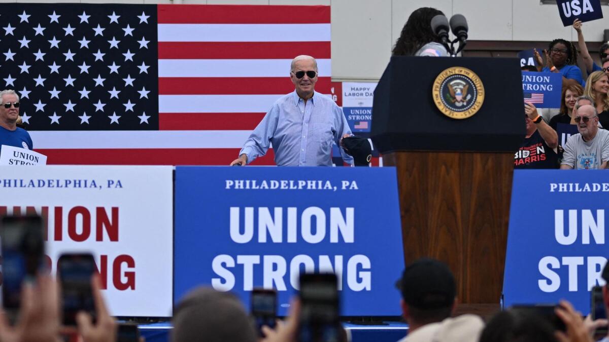 US President Joe Biden waits to address union workers at Sheet Metal Workers Local 19. — AFP
