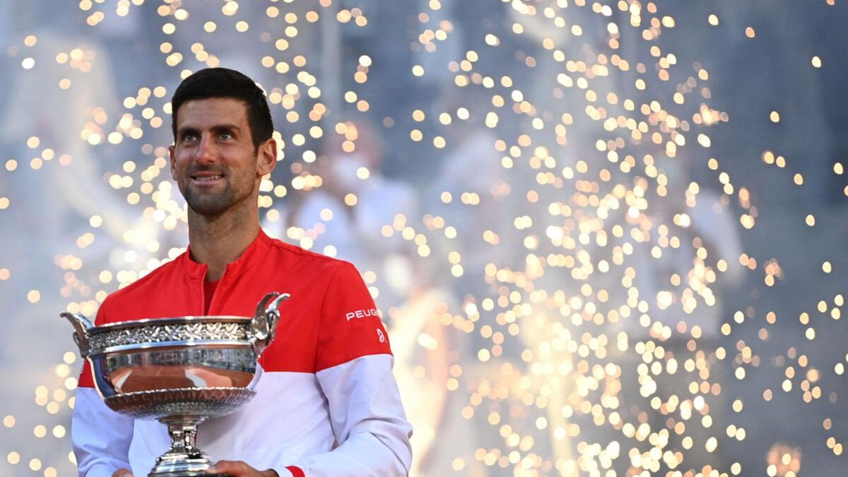 Serbia's Novak Djokovic poses with The Mousquetaires Cup (The Musketeers) after winning the final against Greece's Stefanos Tsitsipas. — AFP