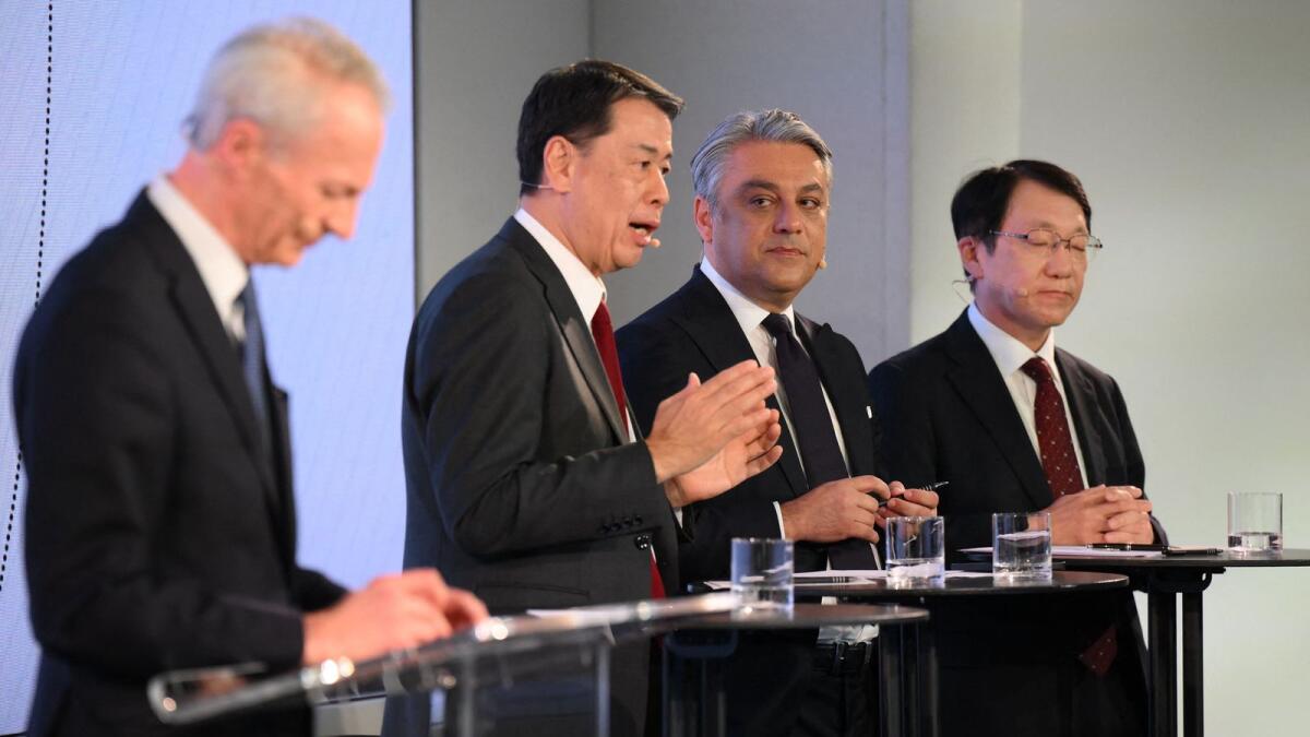 From left: Renault chairperson Jean-Dominique Senard; Nissan chief executive officer Makoto Uchida; Renault chief executive officer Luca de Meo; and Mitsubishi Motors chief executive officer Takao Kato attend a press conference in London on February 6, 2023. The boards of French automaker Renault and Japanese partner Nissan have approved a major overhaul of their rocky 24-year alliance following months of negotiations, the companies announced. — AFP